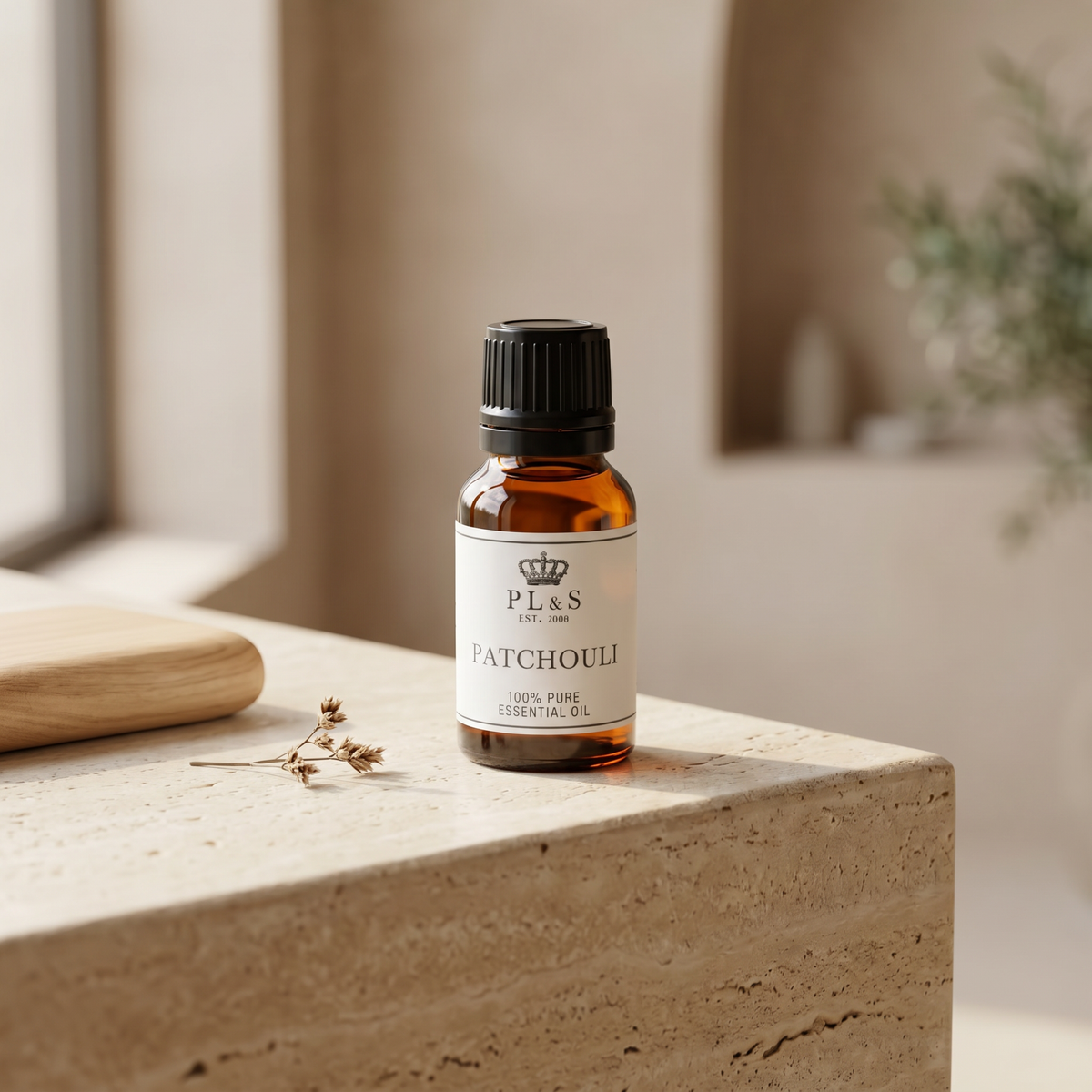 a small bottle of essential oil on a stone surface