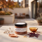 a jar of brown sugar scrub on a table
