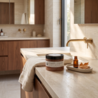 a bathroom with a sink and a bottle of body lotion