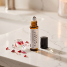 a bottle of perfume on a marble counter