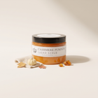 a jar of orange scrub