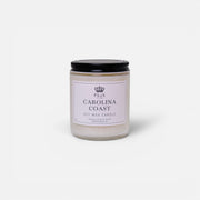 a white candle with black lid