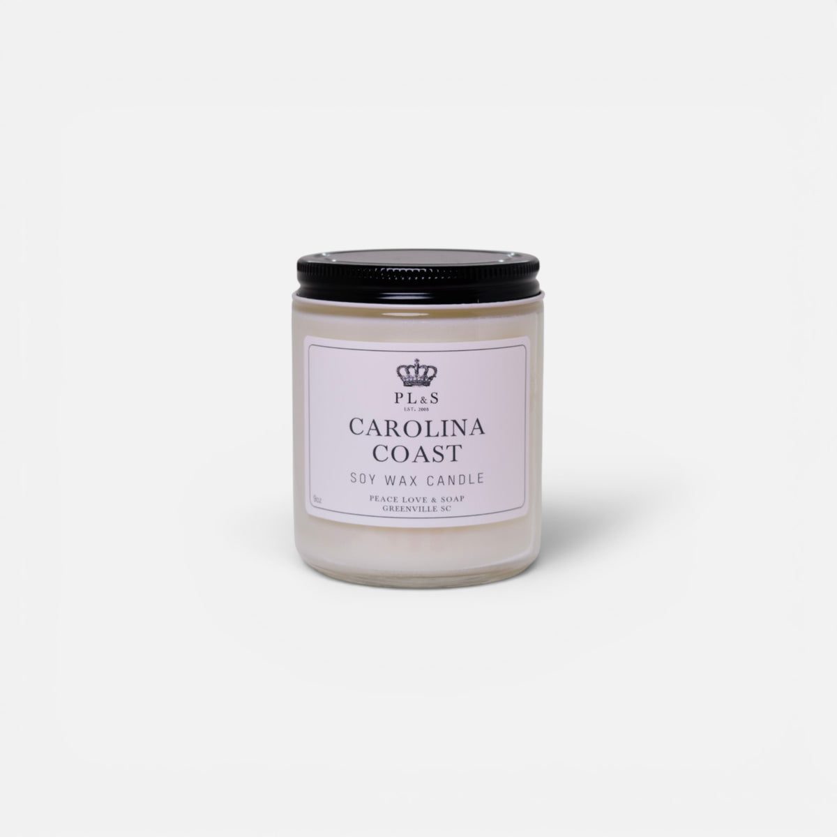 a white candle with black lid