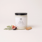 a jar of white candle with a slice of fig and a stick