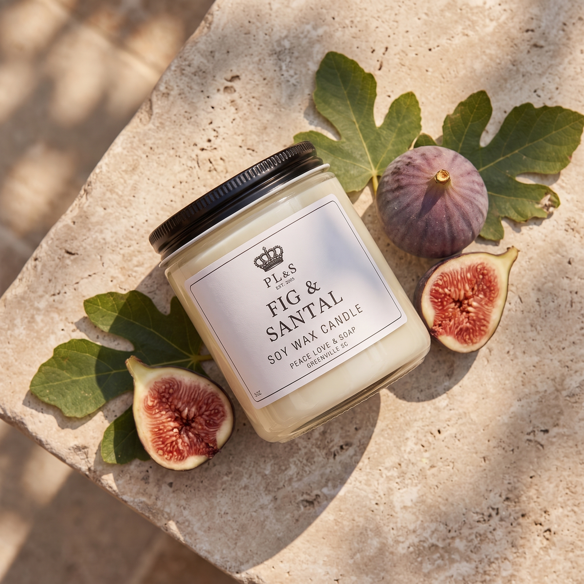 a candle with figs on a stone surface