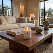 a candle on a coffee table in a living room