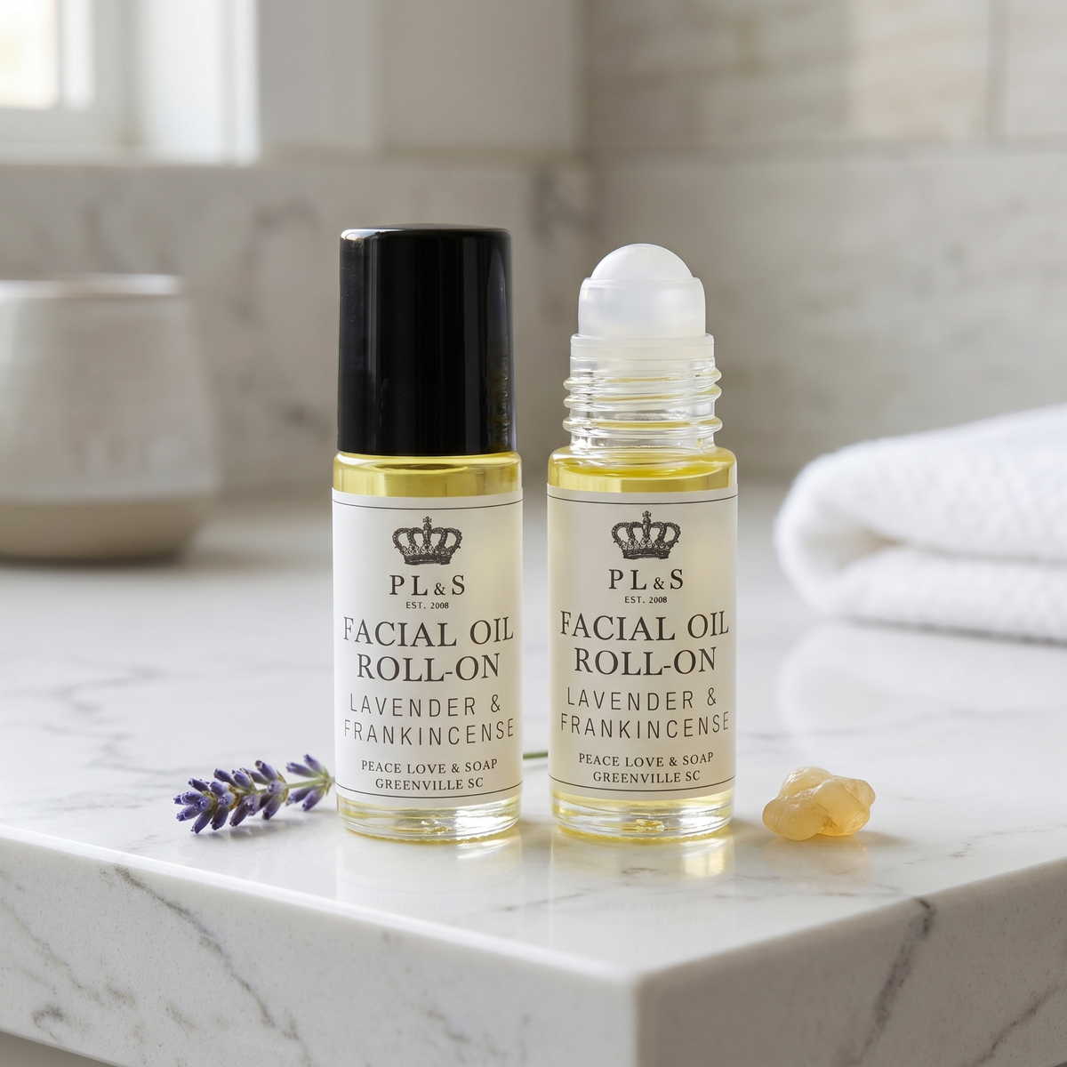 two bottles of oil on a counter