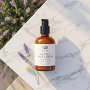 a bottle of cream on a marble surface