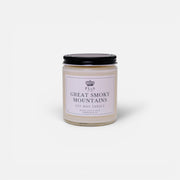 a white candle with black lid