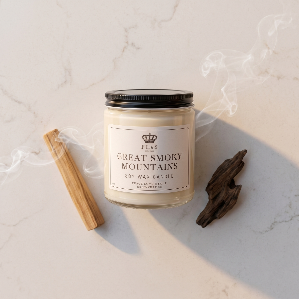 a candle and a stick on a marble surface