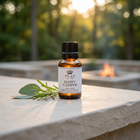 a small bottle of essential oil on a stone ledge