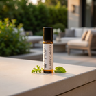 a small bottle of essential oil on a ledge