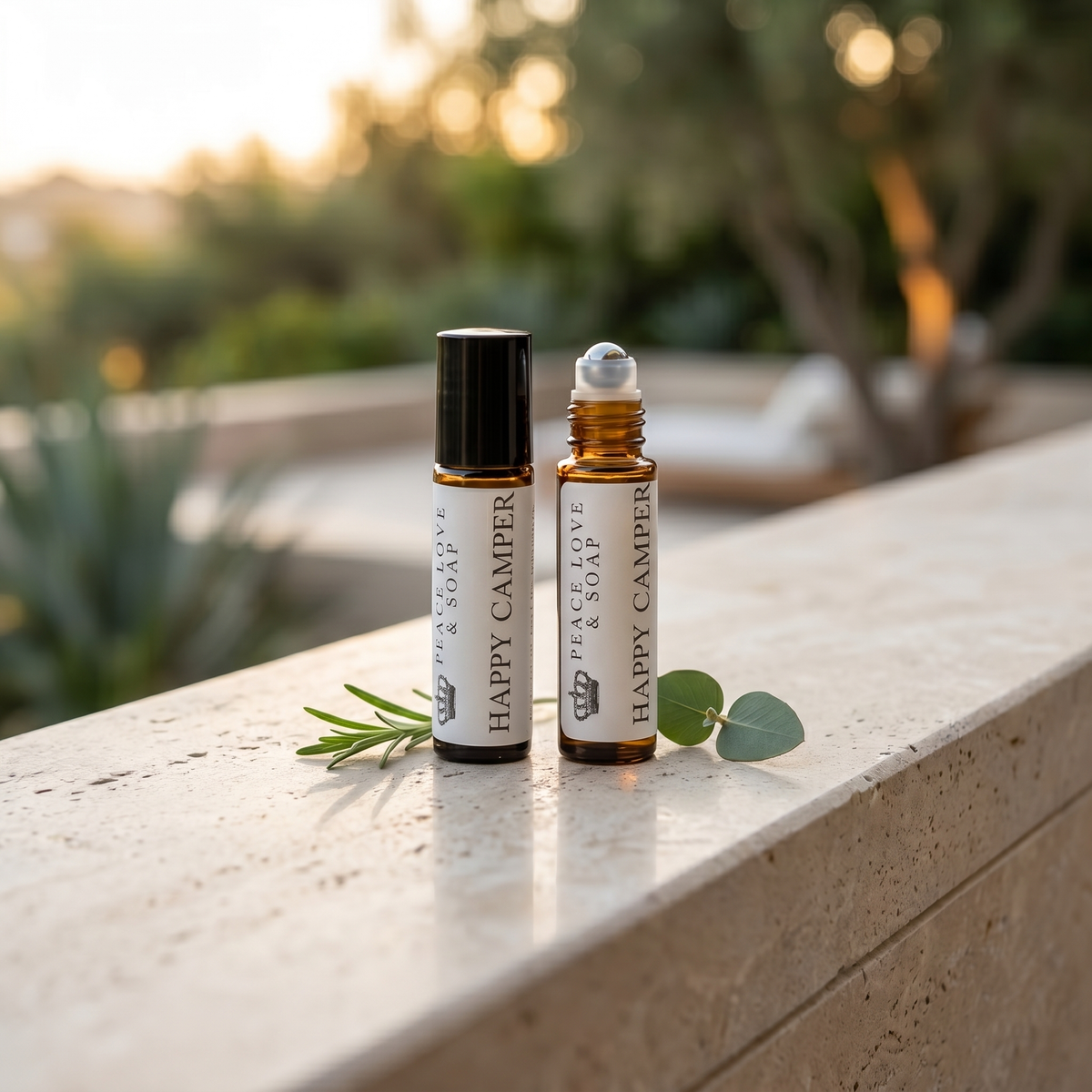 two small bottles of essential oils on a ledge