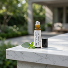 a small bottle of oil on a marble surface