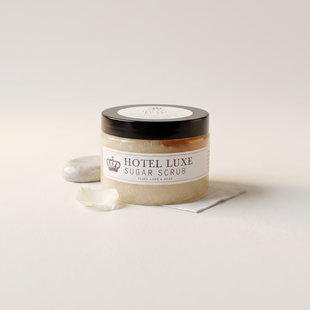 a jar of scrub on a white surface