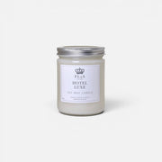 a white candle with a silver lid