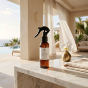 a bottle of spray on a marble counter