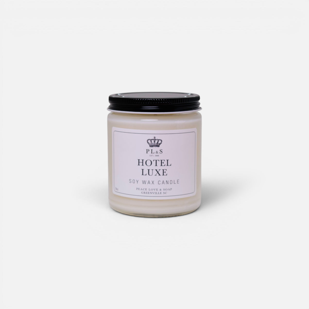 a white candle with black lid