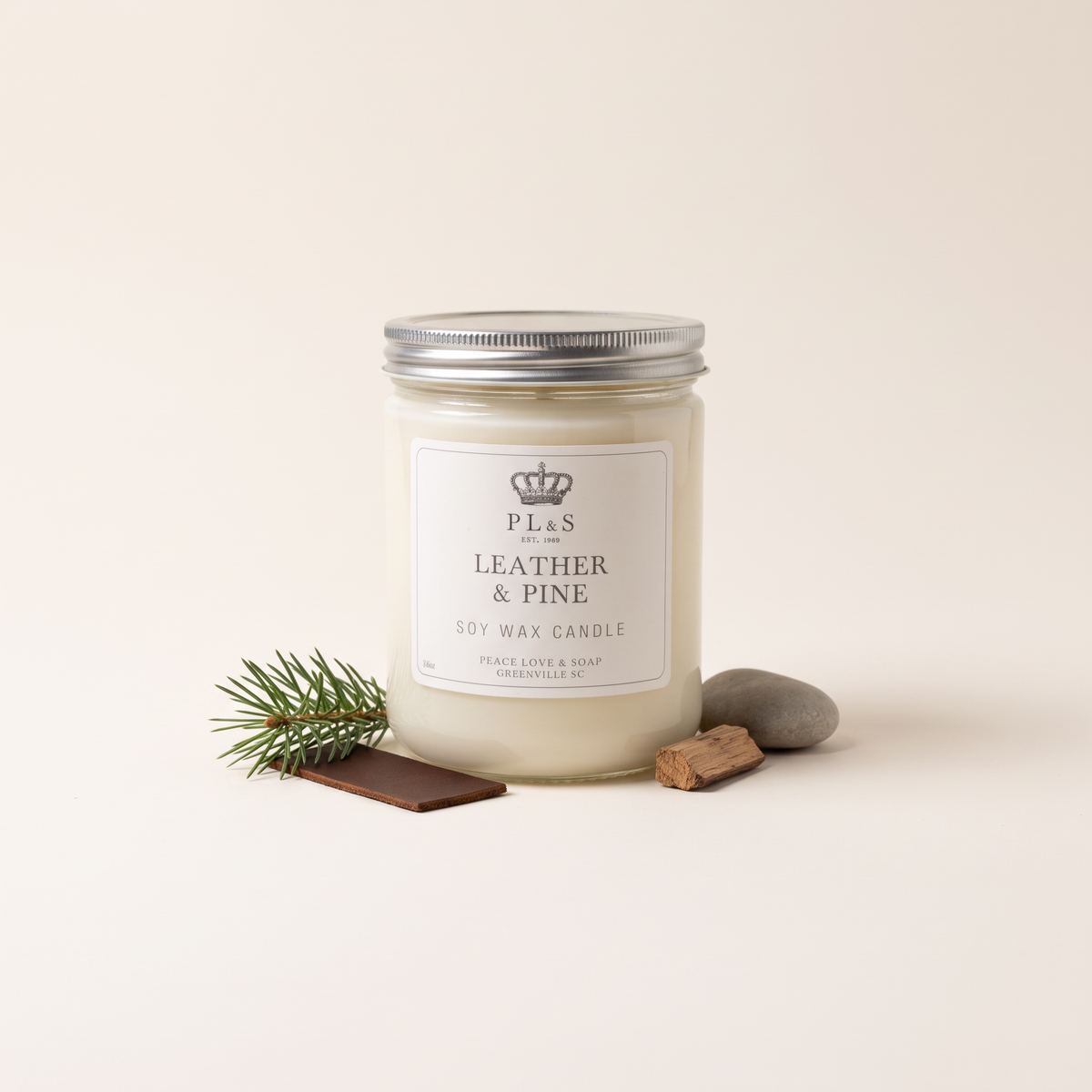 a white candle in a jar