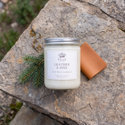 a white candle on a rock