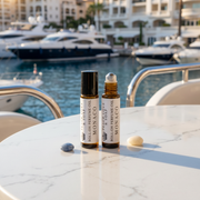 two bottles of essential oils on a table