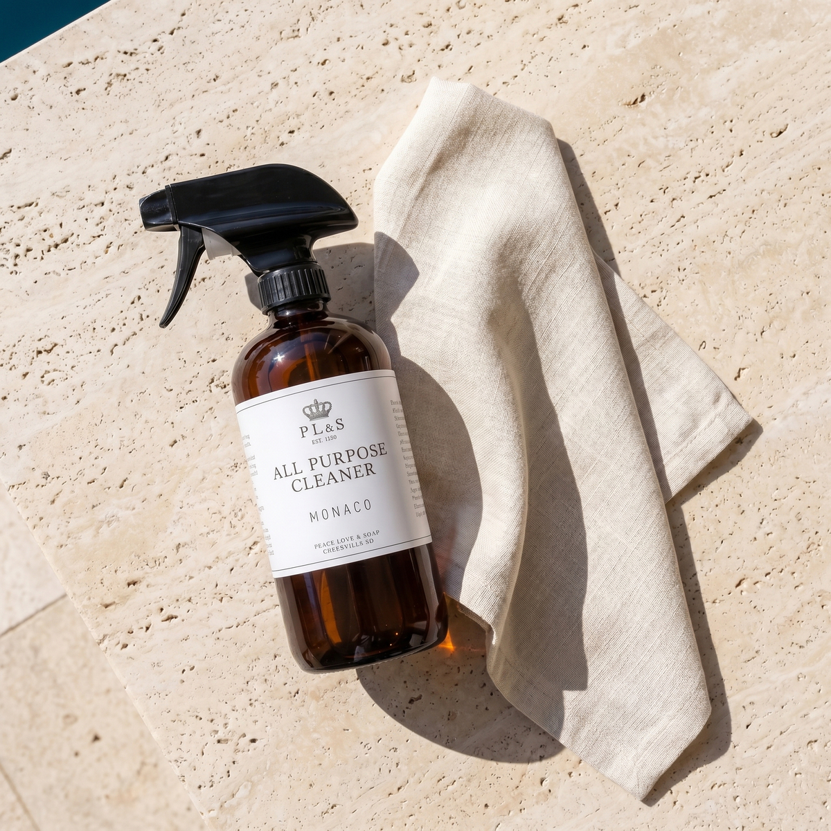 a bottle of cleaning spray and a towel