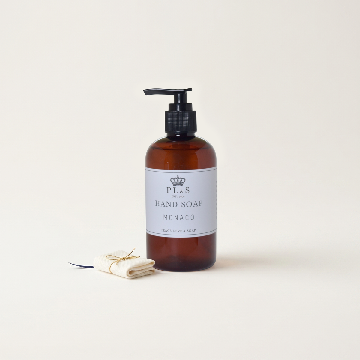 a bottle of liquid soap and a cloth