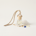 a small glass bottle with wooden rings and beads
