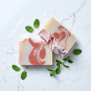 a piece of soap with mint leaves