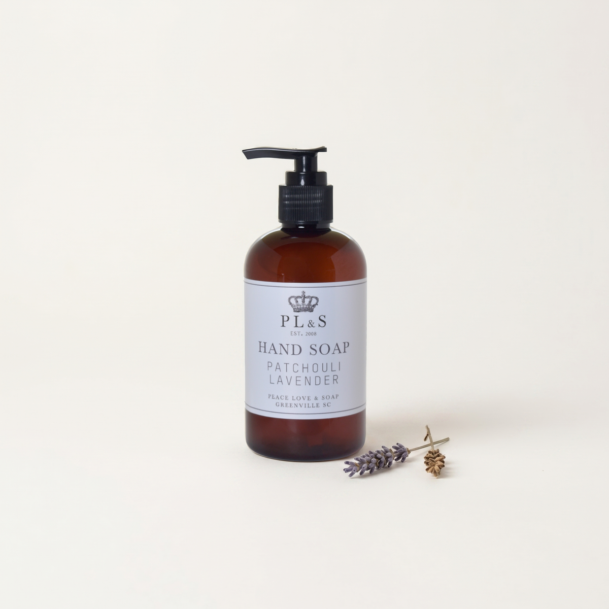 a bottle of liquid soap and a small flower