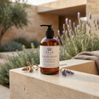 a bottle of soap on a stone ledge