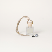 a bottle of perfume with a rope