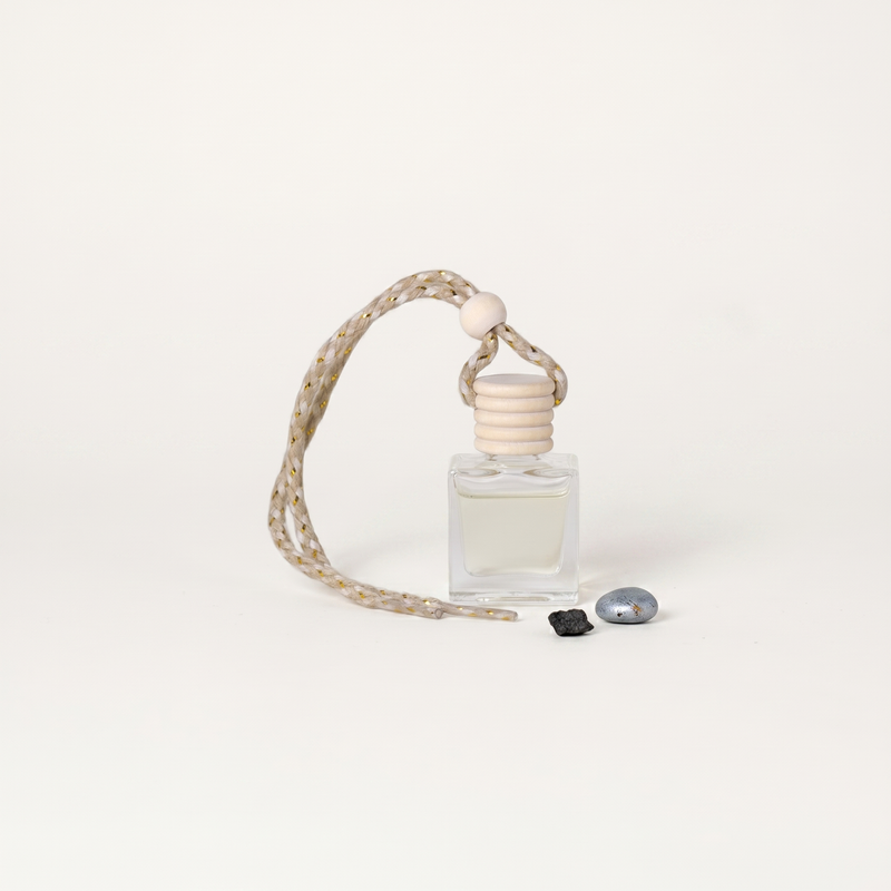a bottle of perfume with a rope
