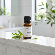 a small bottle of tea tree oil on a marble counter
