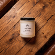 a white candle on a wooden table
