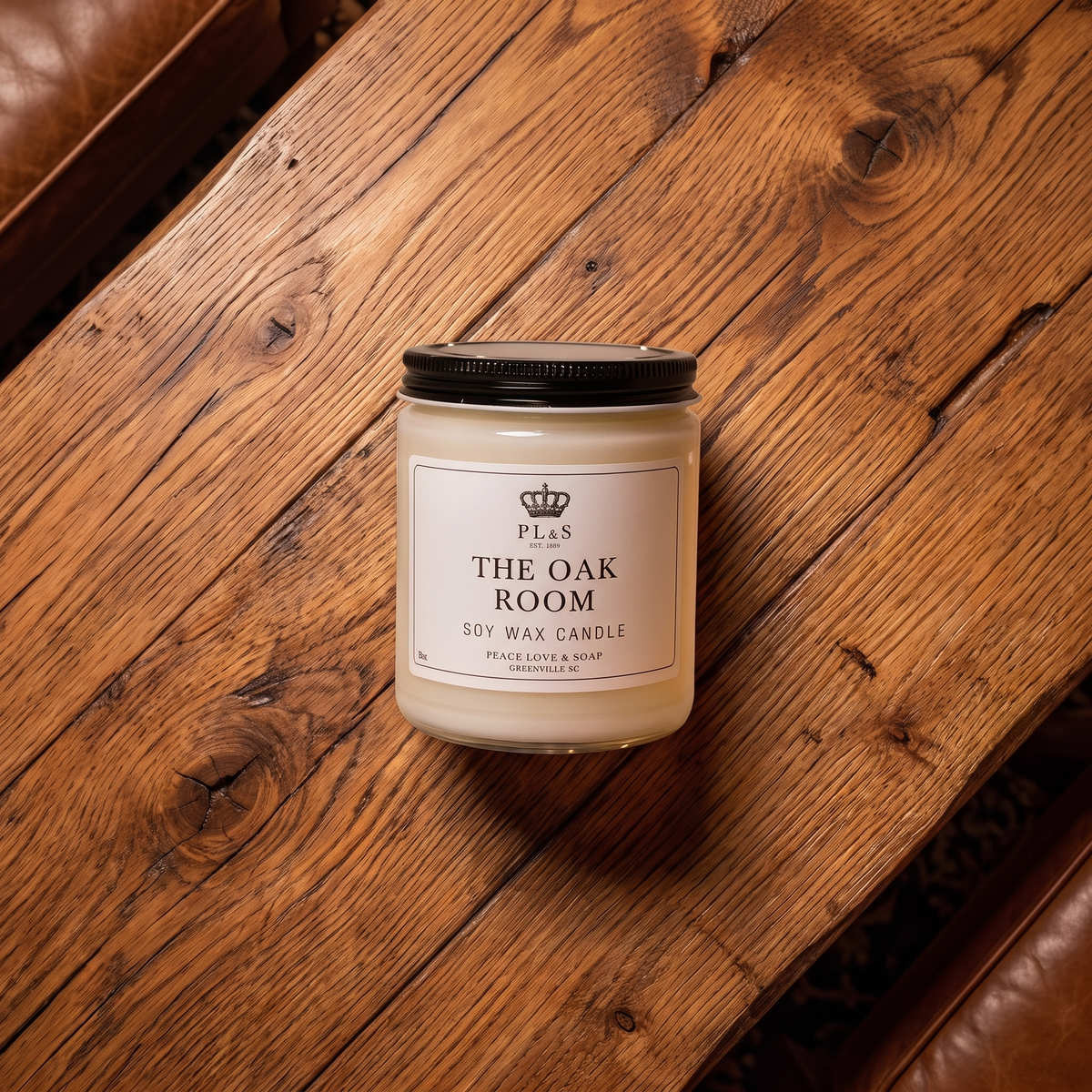 a white candle on a wooden table