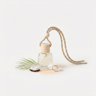 a bottle of oil with a rope
