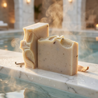 a two pieces of soap on a ledge