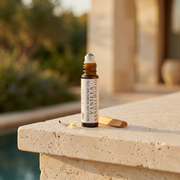 a small bottle of essential oil on a ledge